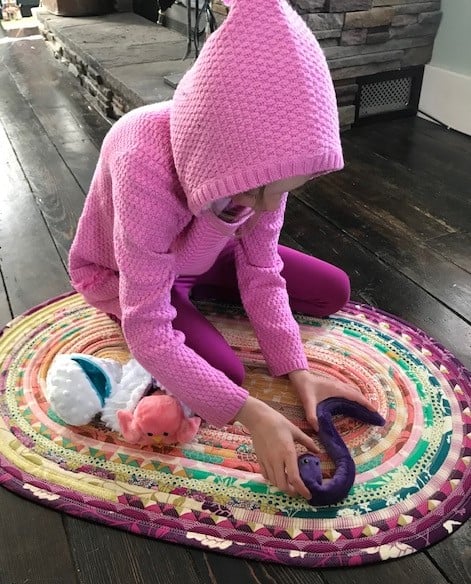 Rose playing with the Cuddle Hatchlings