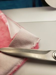 cutting the layers of the bath mat